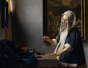 Woman Holding a Balance by Johannes Vermeer